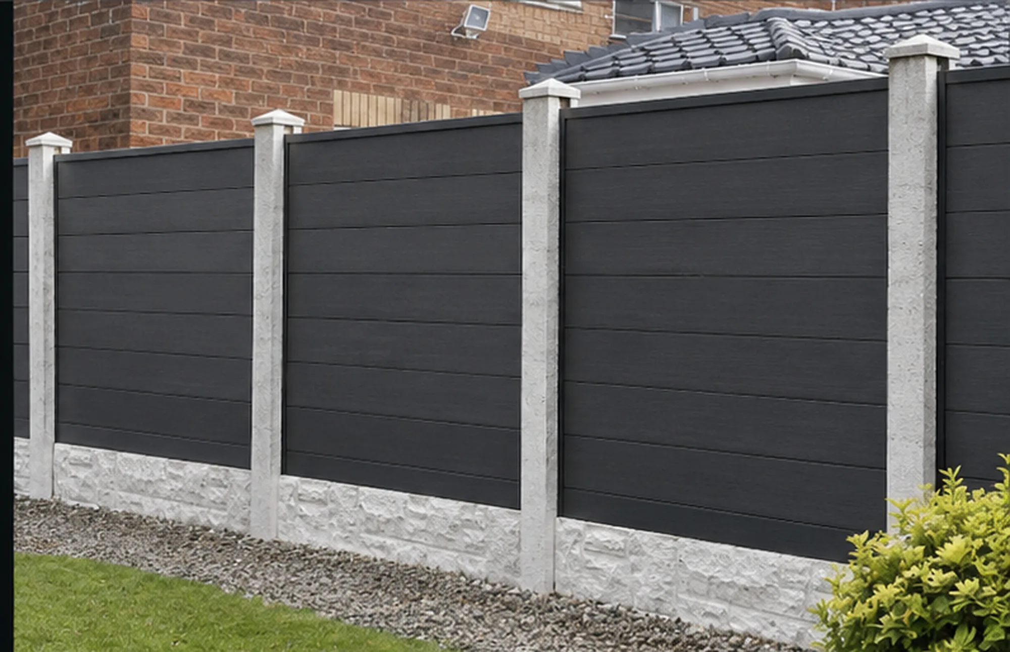 Dark grey Pinnacle composite fencing fitted between existing concrete posts using black insert channels